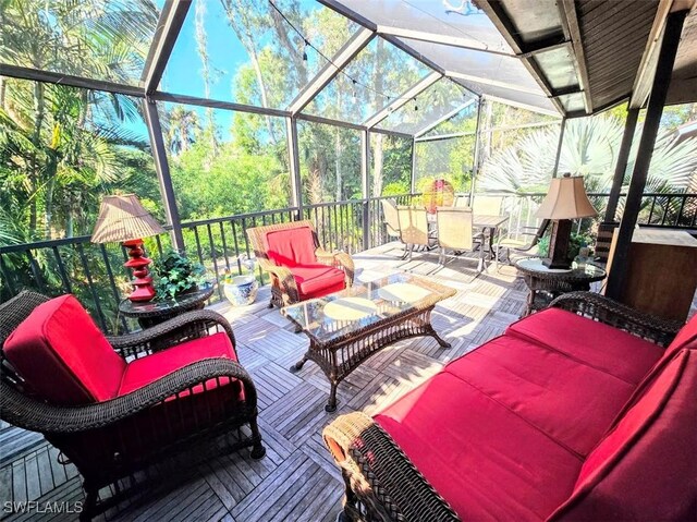 view of patio featuring an outdoor hangout area and glass enclosure