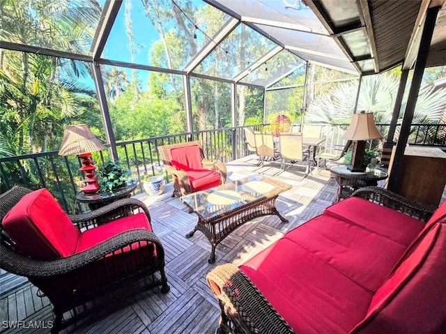 view of patio / terrace with an outdoor hangout area and glass enclosure