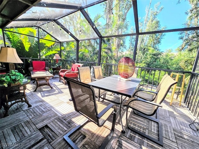 view of patio featuring a lanai