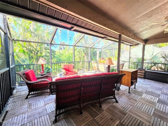 sunroom featuring a jacuzzi