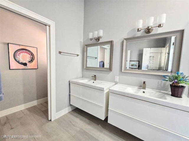 bathroom with wood-type flooring and vanity