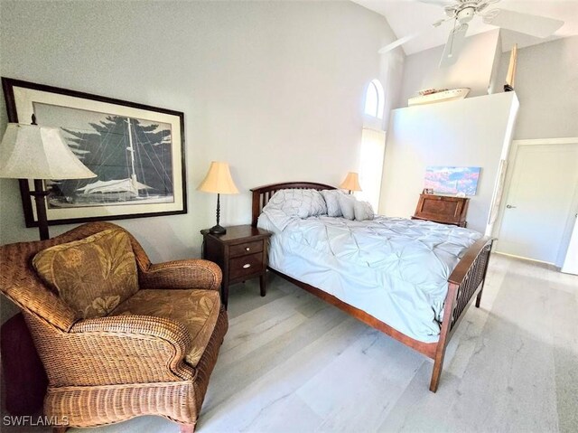 bedroom featuring ceiling fan and vaulted ceiling