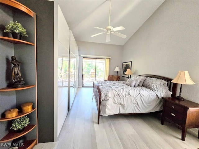 bedroom with access to exterior, light hardwood / wood-style flooring, high vaulted ceiling, and ceiling fan