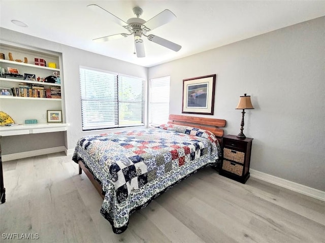 bedroom with ceiling fan and light hardwood / wood-style flooring