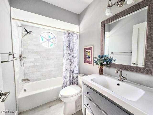 full bathroom featuring vanity, toilet, and shower / bathtub combination with curtain