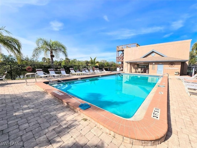 view of swimming pool with a patio area