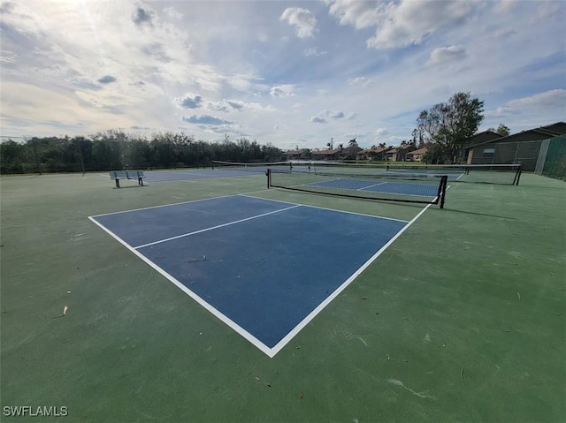 view of sport court with basketball hoop