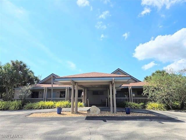 view of front of home with a carport