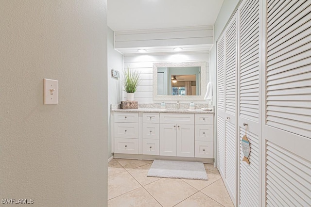 bathroom featuring tile patterned flooring and vanity