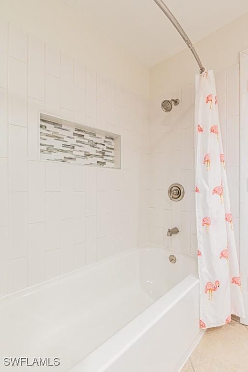 bathroom featuring tile patterned flooring and shower / bath combination with curtain