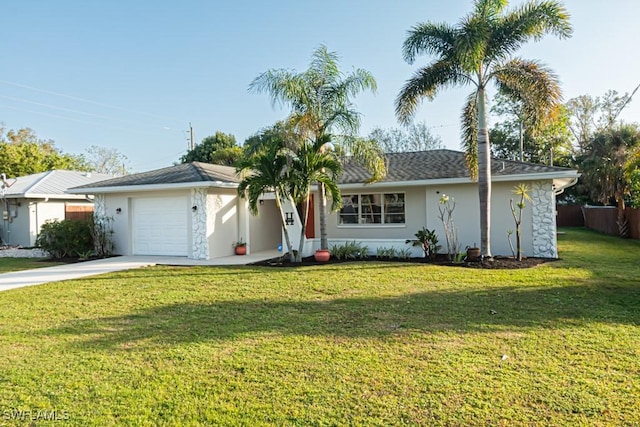 ranch-style house featuring a front lawn and a garage