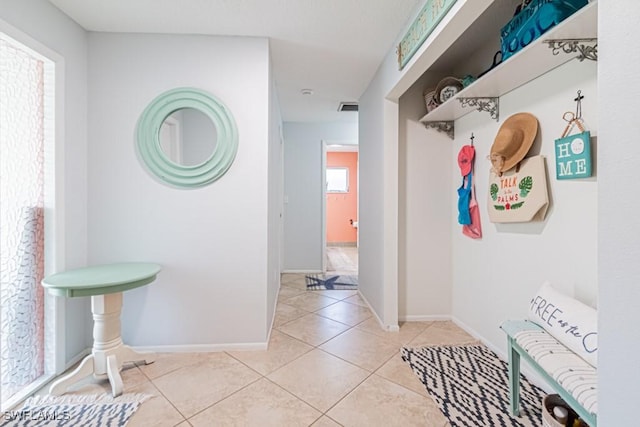 mudroom featuring light tile patterned floors