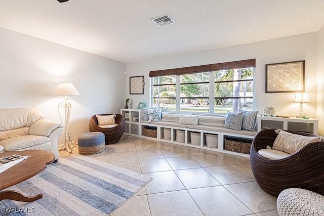 sitting room featuring light tile patterned floors