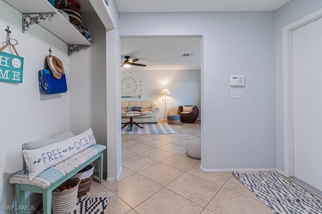 mudroom featuring tile patterned flooring and ceiling fan