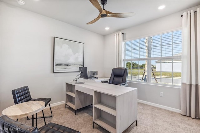 office area featuring recessed lighting, baseboards, a ceiling fan, and light colored carpet