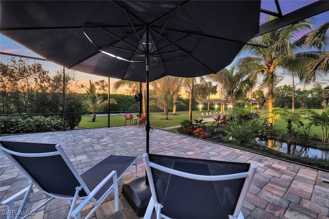 view of patio terrace at dusk