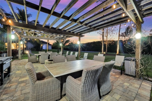 patio terrace at dusk with a pergola