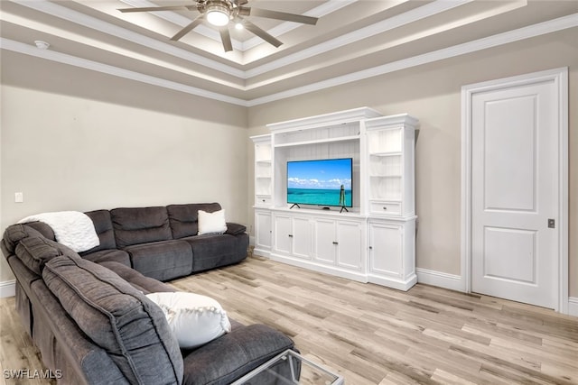 living room with light hardwood / wood-style floors, a raised ceiling, ceiling fan, and crown molding