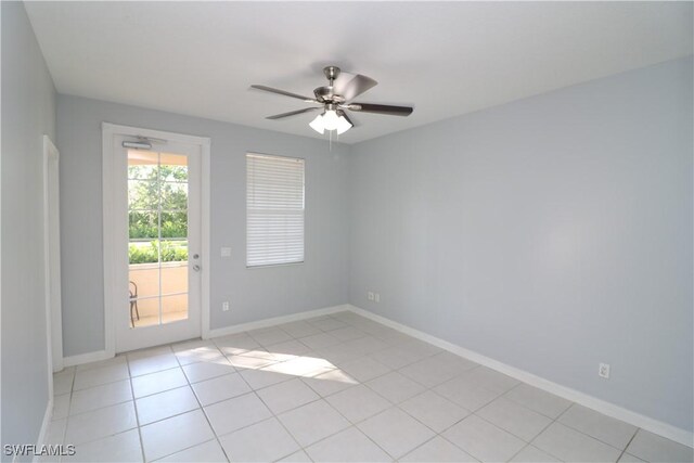 tiled empty room with ceiling fan