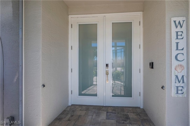 entrance to property featuring french doors