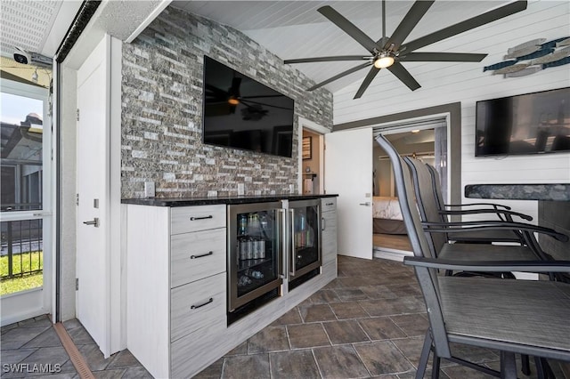 view of patio / terrace with ceiling fan and wine cooler