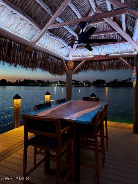 dock area featuring a deck with water view and a gazebo