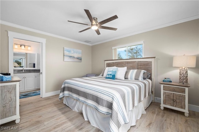 bedroom featuring sink, light hardwood / wood-style flooring, ensuite bath, ceiling fan, and ornamental molding