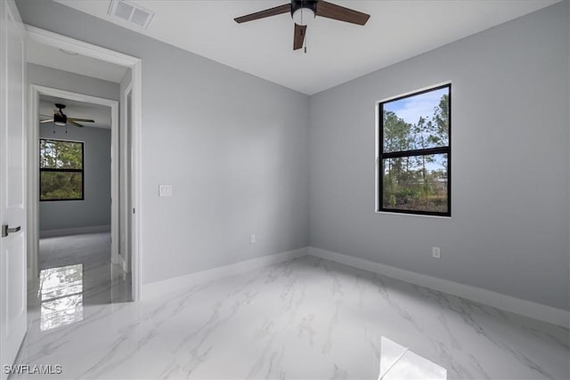 spare room with ceiling fan