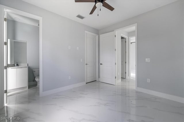 unfurnished bedroom with ceiling fan and ensuite bath