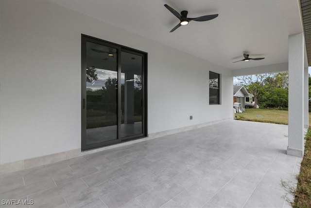 view of patio featuring ceiling fan