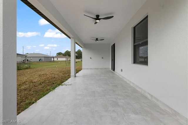 view of patio featuring ceiling fan