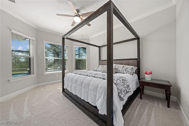 bedroom featuring ornamental molding, carpet, and ceiling fan