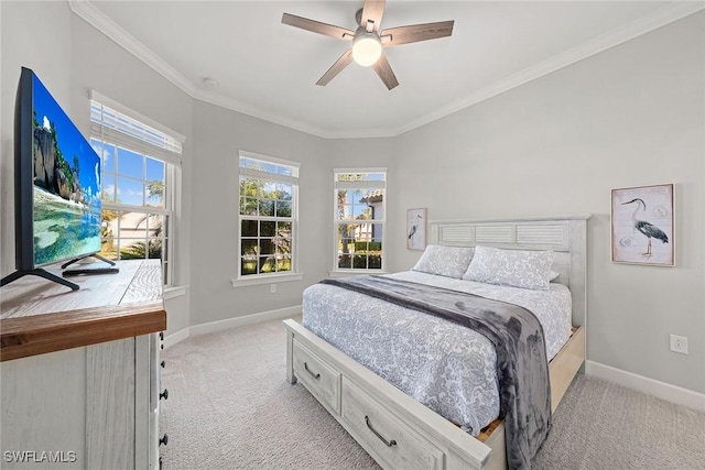 bedroom with crown molding, light colored carpet, and ceiling fan