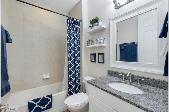 full bathroom with shower / bath combination with curtain, vanity, and toilet