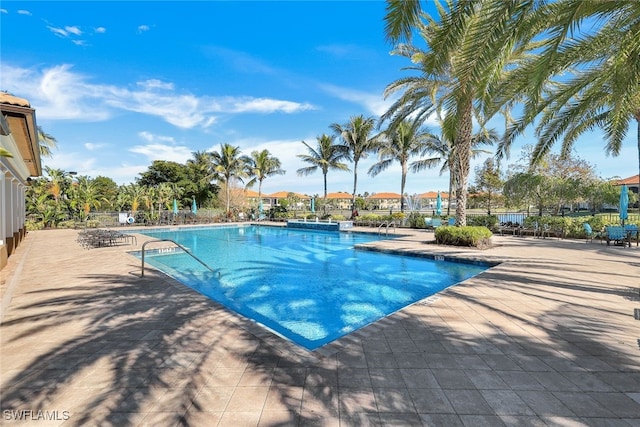 view of swimming pool with a patio