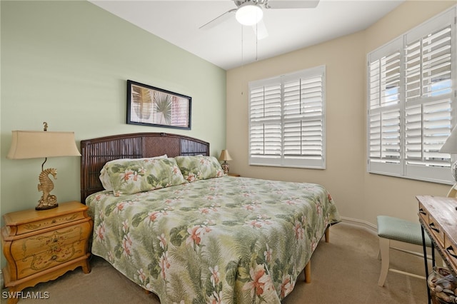 carpeted bedroom featuring ceiling fan