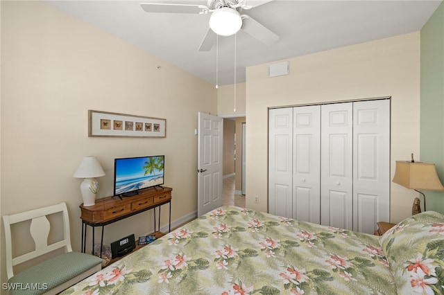 bedroom with ceiling fan and a closet