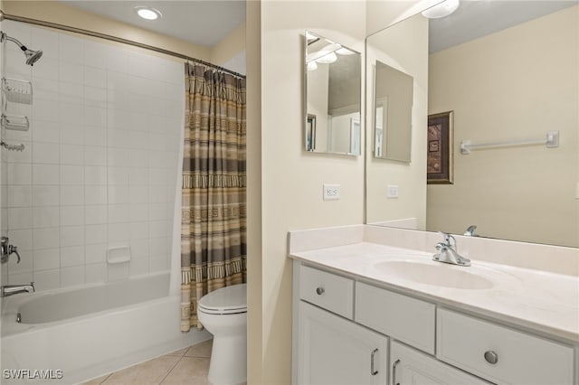 full bathroom featuring toilet, tile patterned floors, vanity, and shower / bath combo