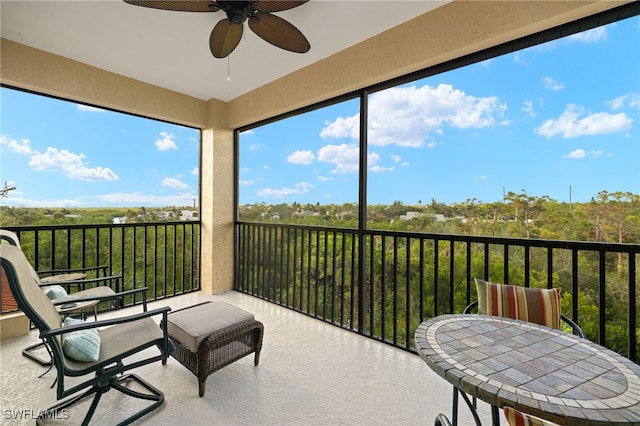 sunroom / solarium with ceiling fan