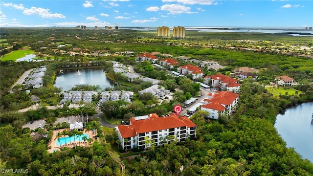 birds eye view of property with a water view