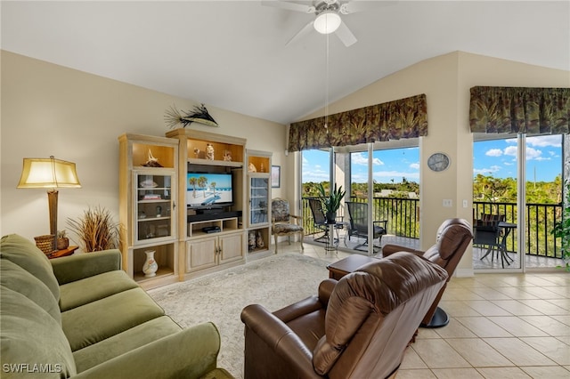 tiled living room featuring ceiling fan and lofted ceiling