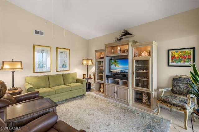 tiled living room with lofted ceiling