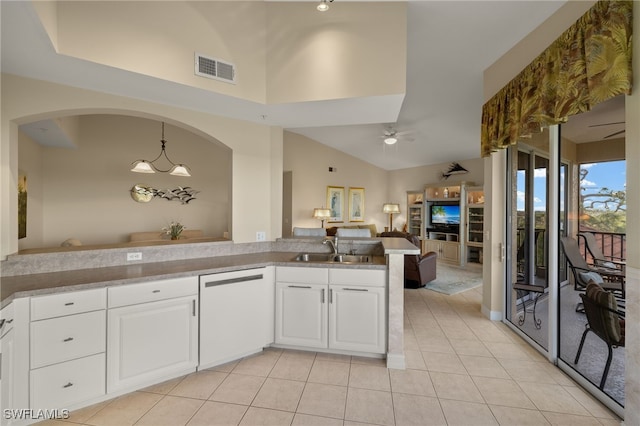 kitchen featuring ceiling fan, dishwashing machine, pendant lighting, sink, and white cabinets