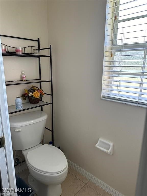 bathroom featuring tile patterned floors and toilet