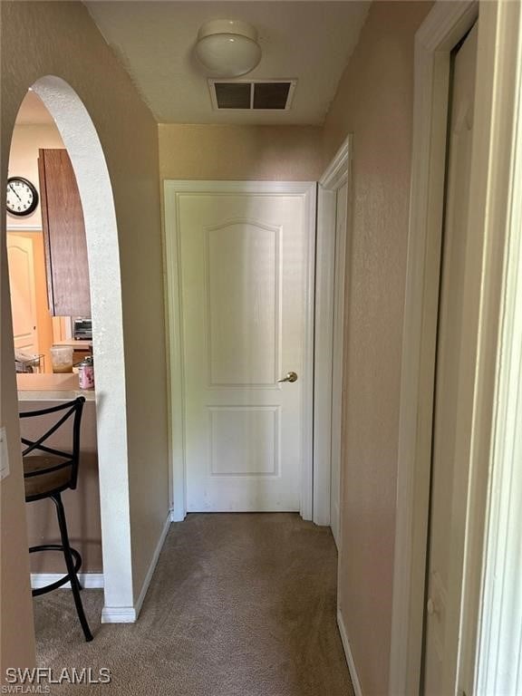 hallway featuring carpet flooring