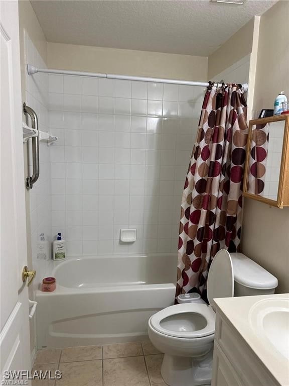 full bathroom featuring vanity, tile patterned floors, toilet, shower / bathtub combination with curtain, and a textured ceiling