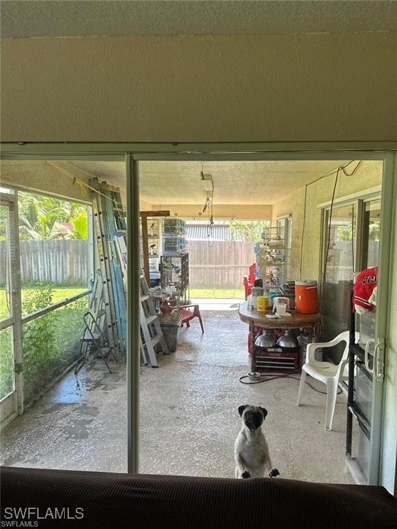 unfurnished sunroom with a wealth of natural light