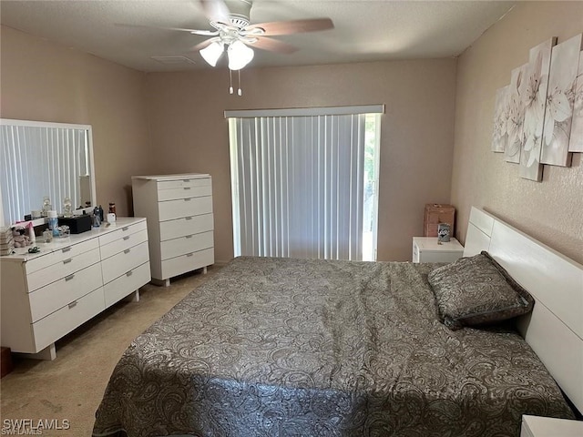 bedroom with ceiling fan and light carpet