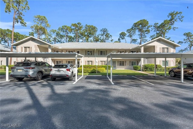 view of vehicle parking featuring a carport