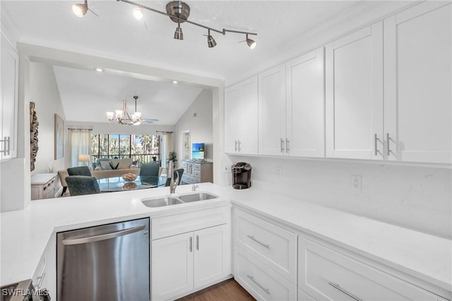 kitchen with stainless steel dishwasher, white cabinetry, and sink